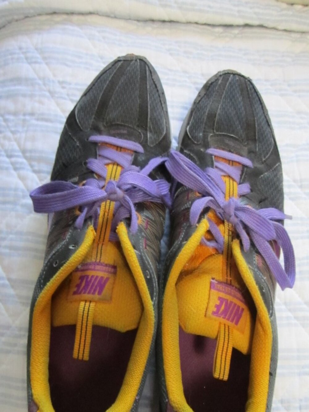 Nike Women's Gray Athletic Shoes with Purple Laces and Yellow Accents